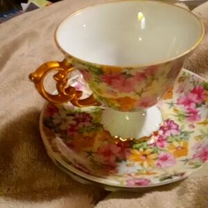 Vintage chintz floral teacup and 3 saucers